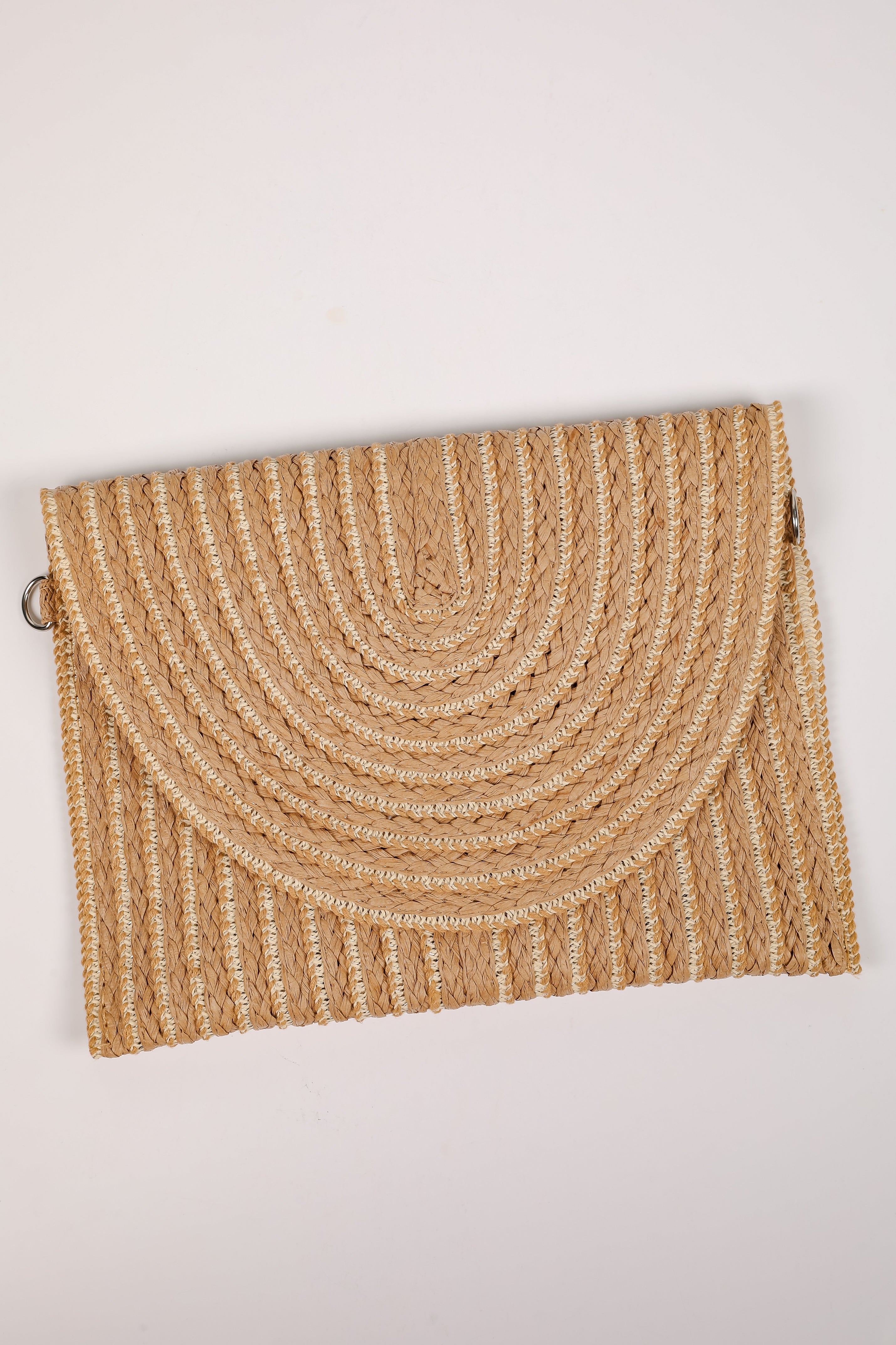 Woven clutch bag on a light beige background