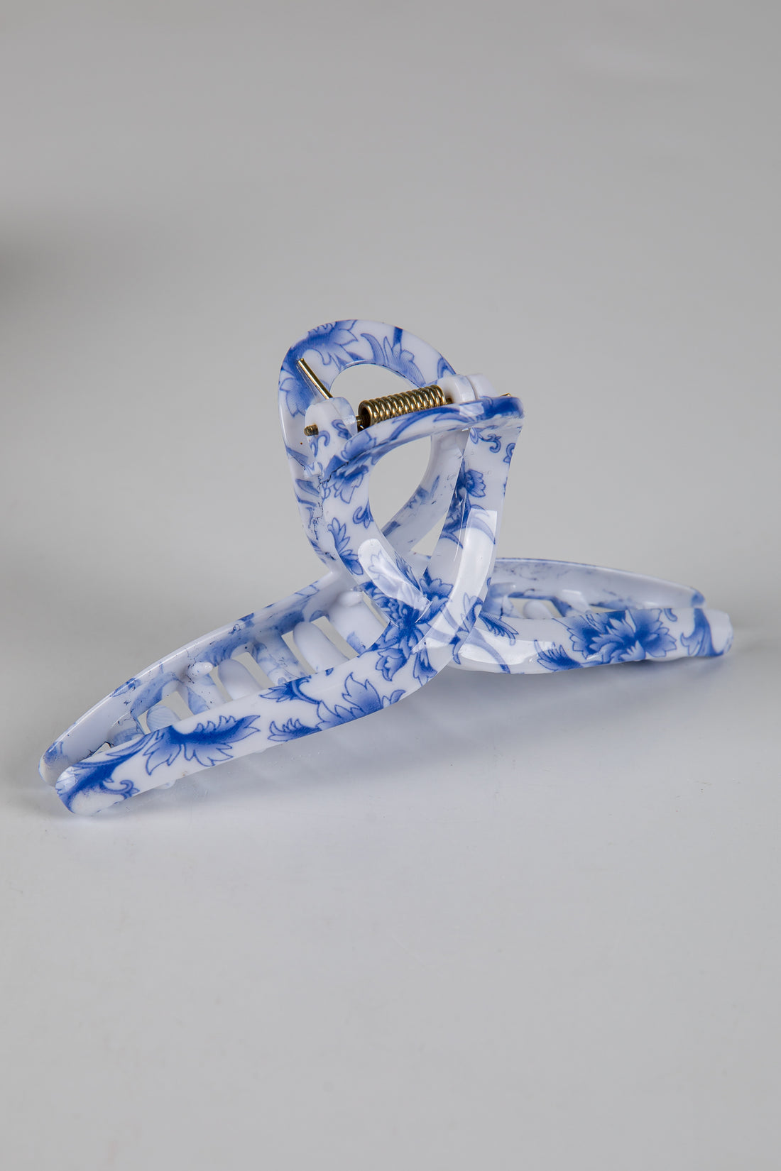 Blue and white marbled hanger on a gray background