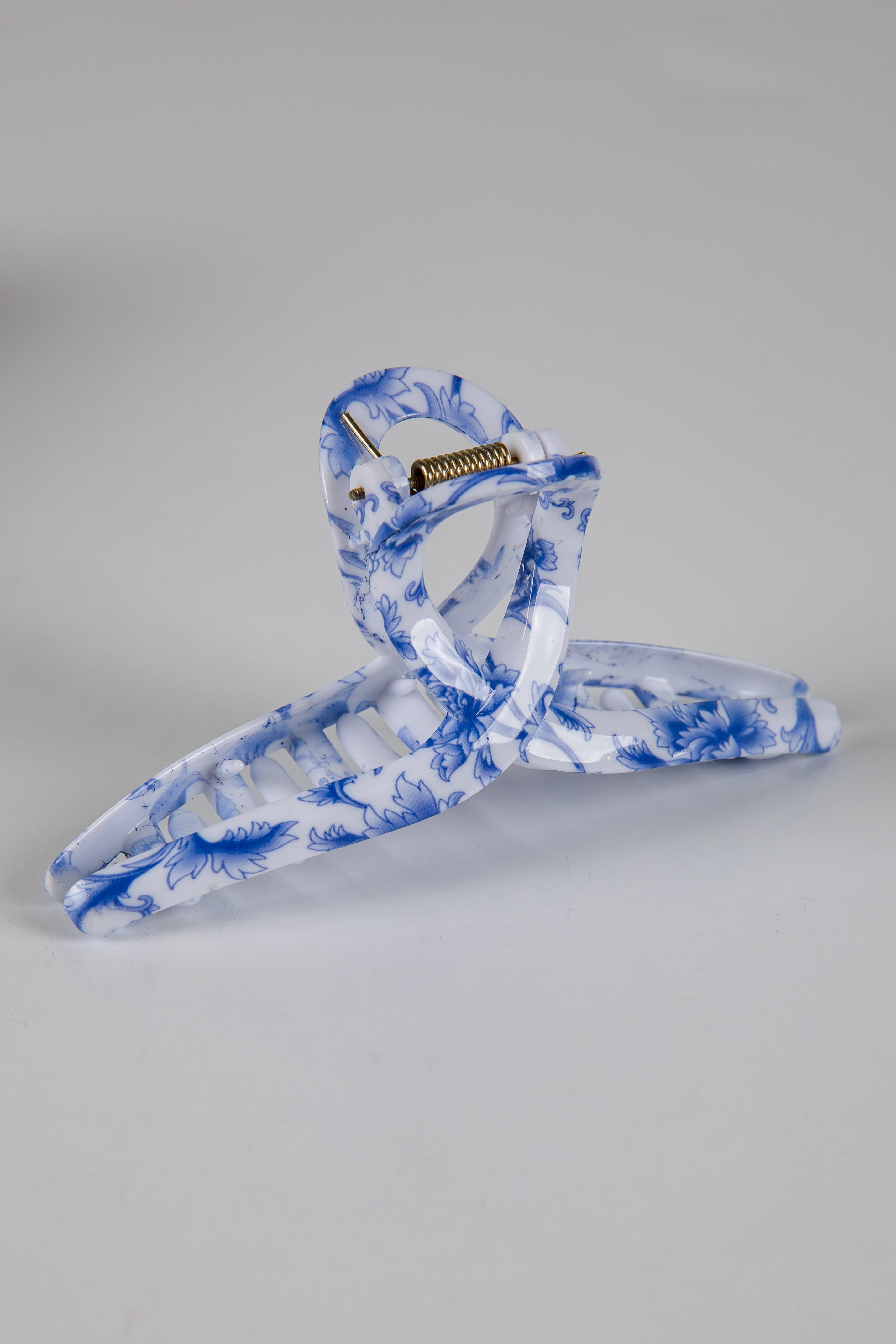 Blue and white marbled hanger on a gray background