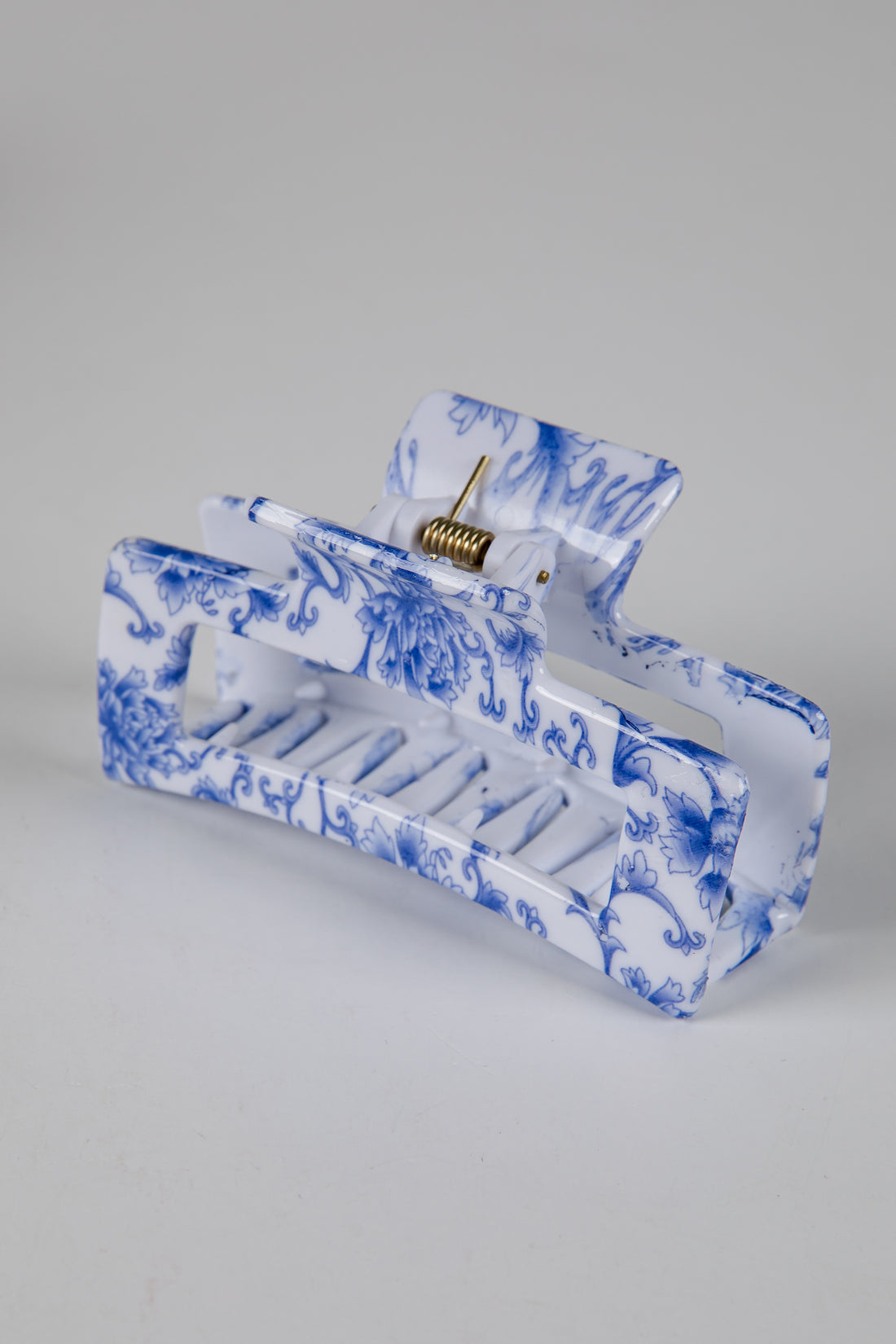 Blue and white marbled design on a rectangular object against a gray background