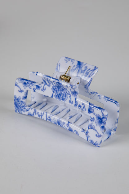 Blue and white marbled design on a rectangular object against a gray background
