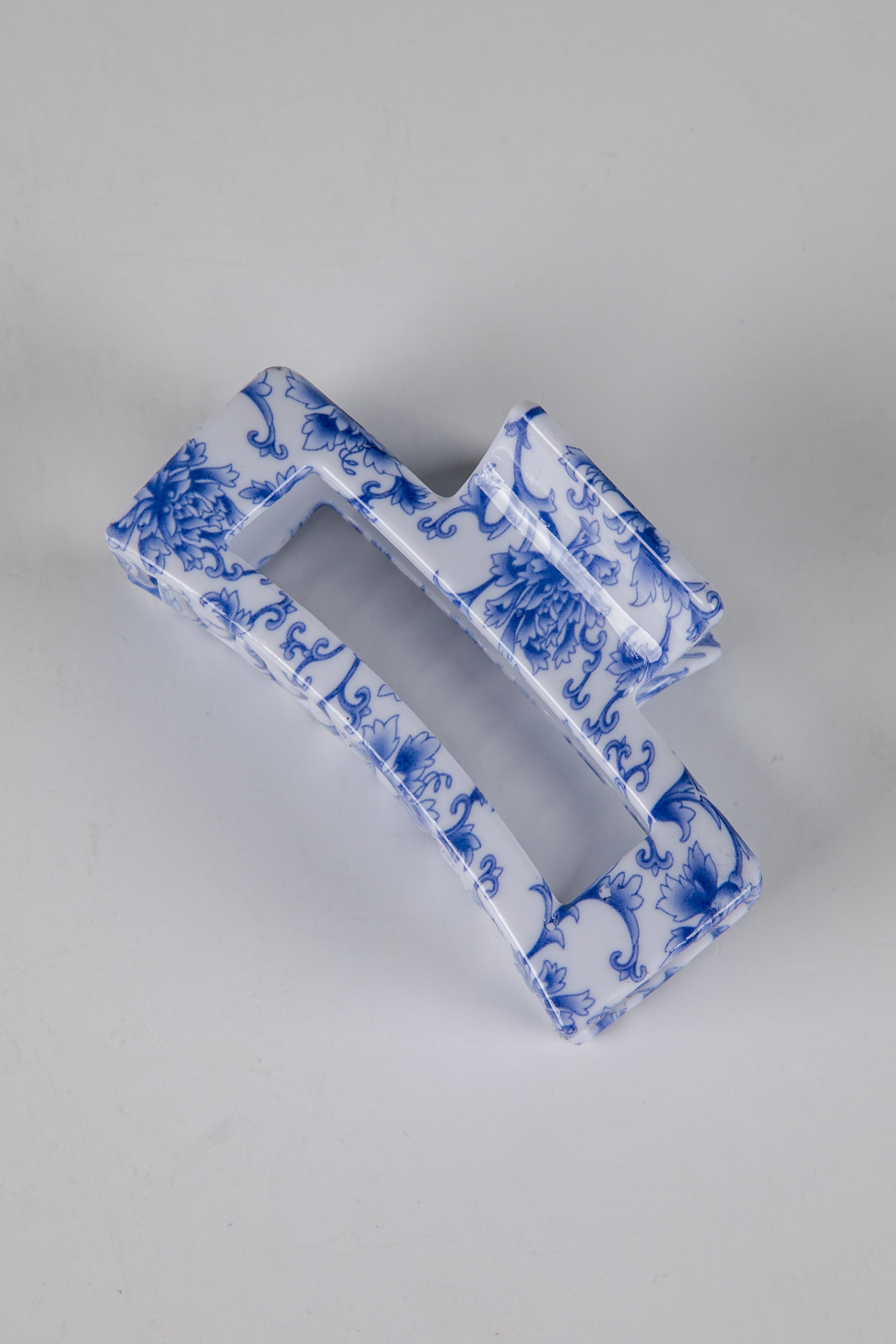 Blue and white decorative item on a gray background