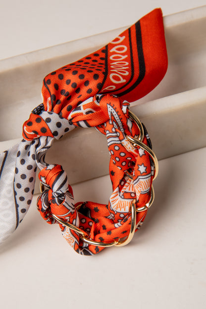 Set of colorful scrunchies with patterns on a light background