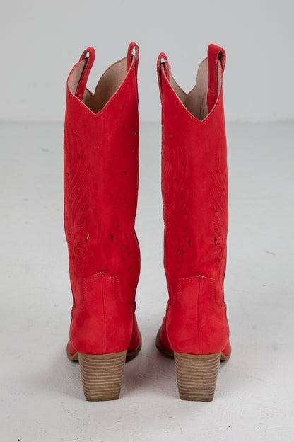 Pair of red cowboy boots on a white background