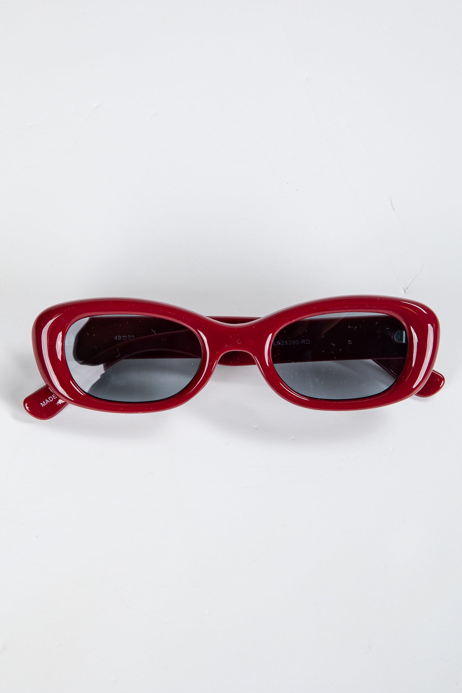 Red sunglasses on a white background