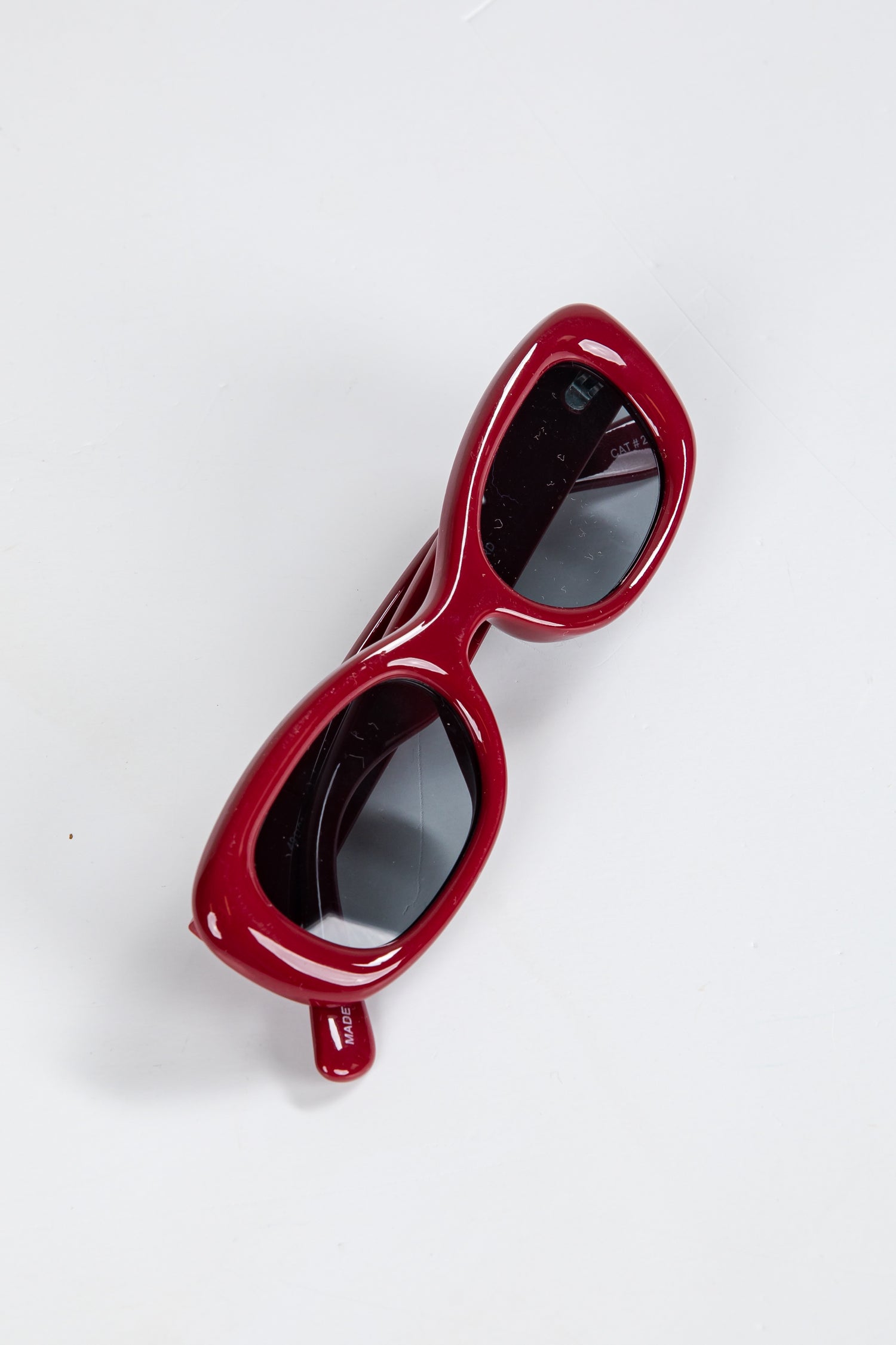 Red sunglasses on a white background