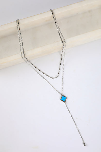 Necklace with a blue pendant on a white background