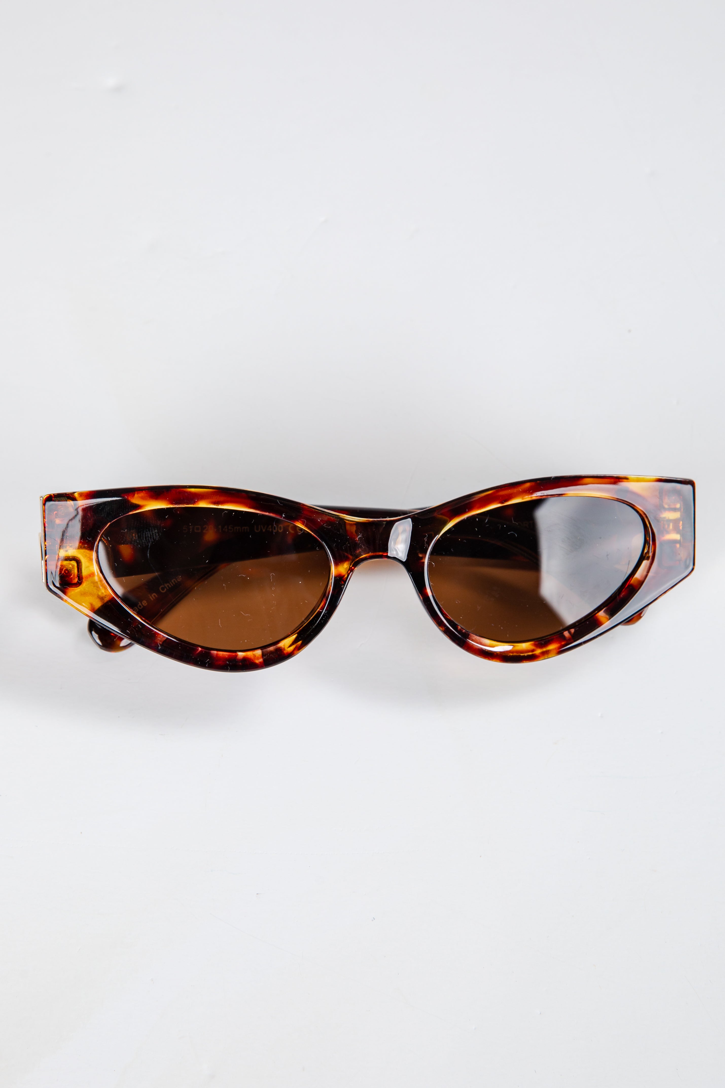 Tortoiseshell sunglasses on a white background