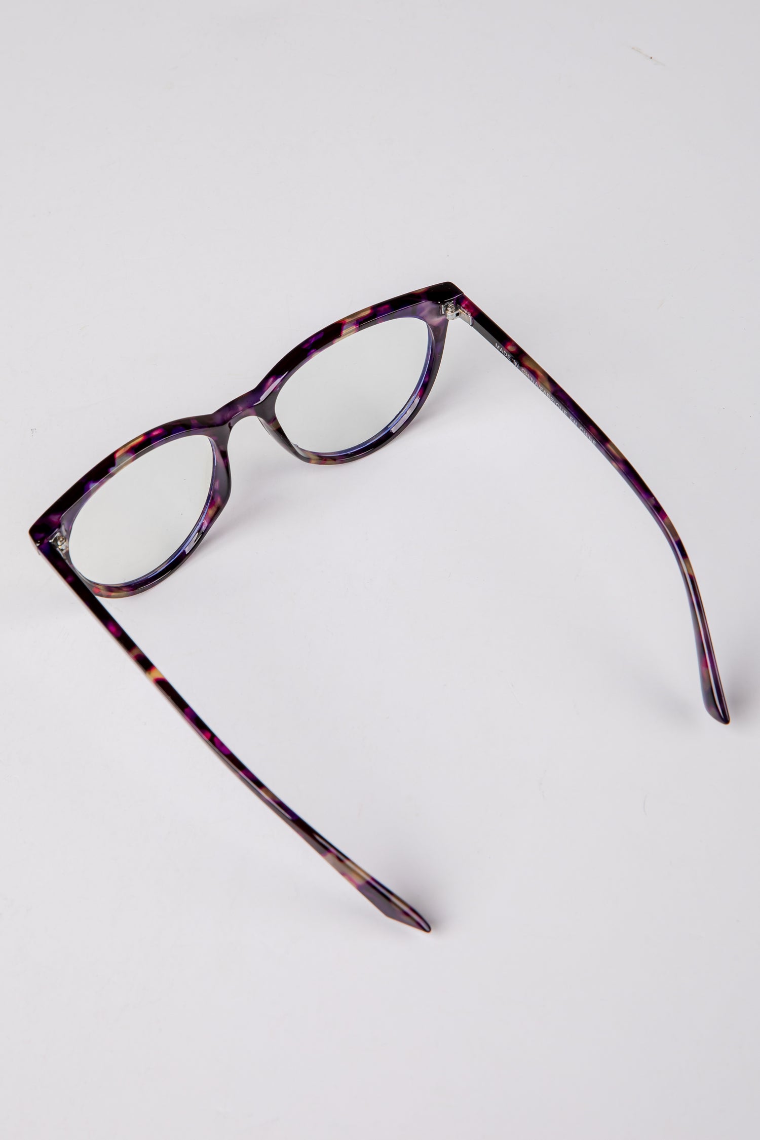 Tortoiseshell eyeglasses on a white background