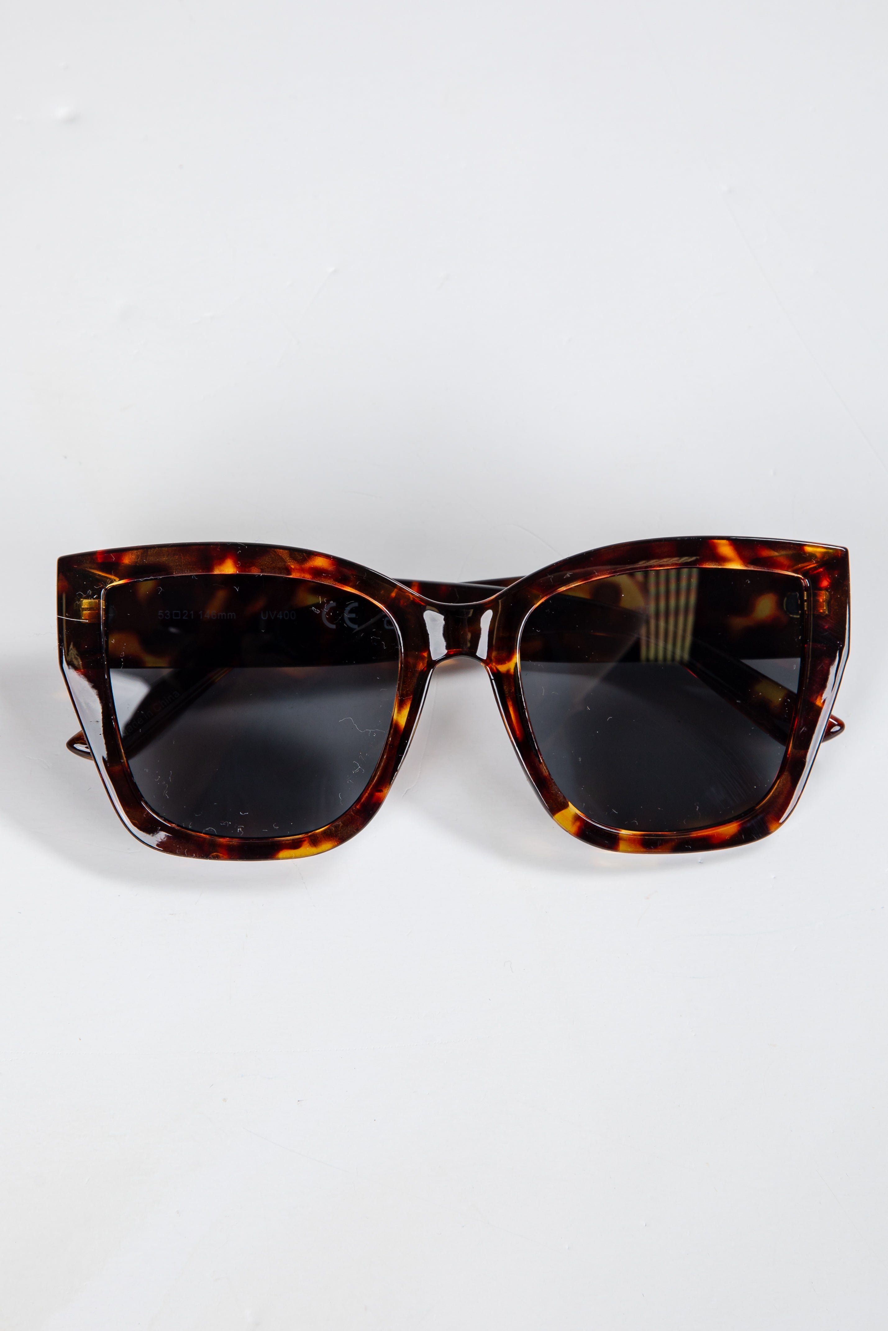 Tortoiseshell sunglasses on a white background