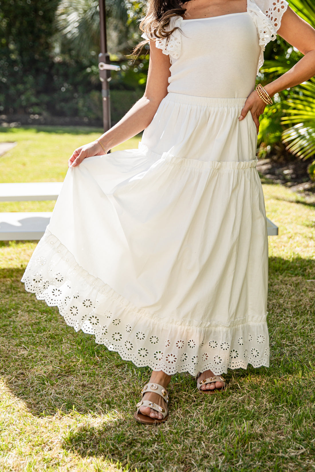 Cream eyelet lace maxi skirt styled outdoors