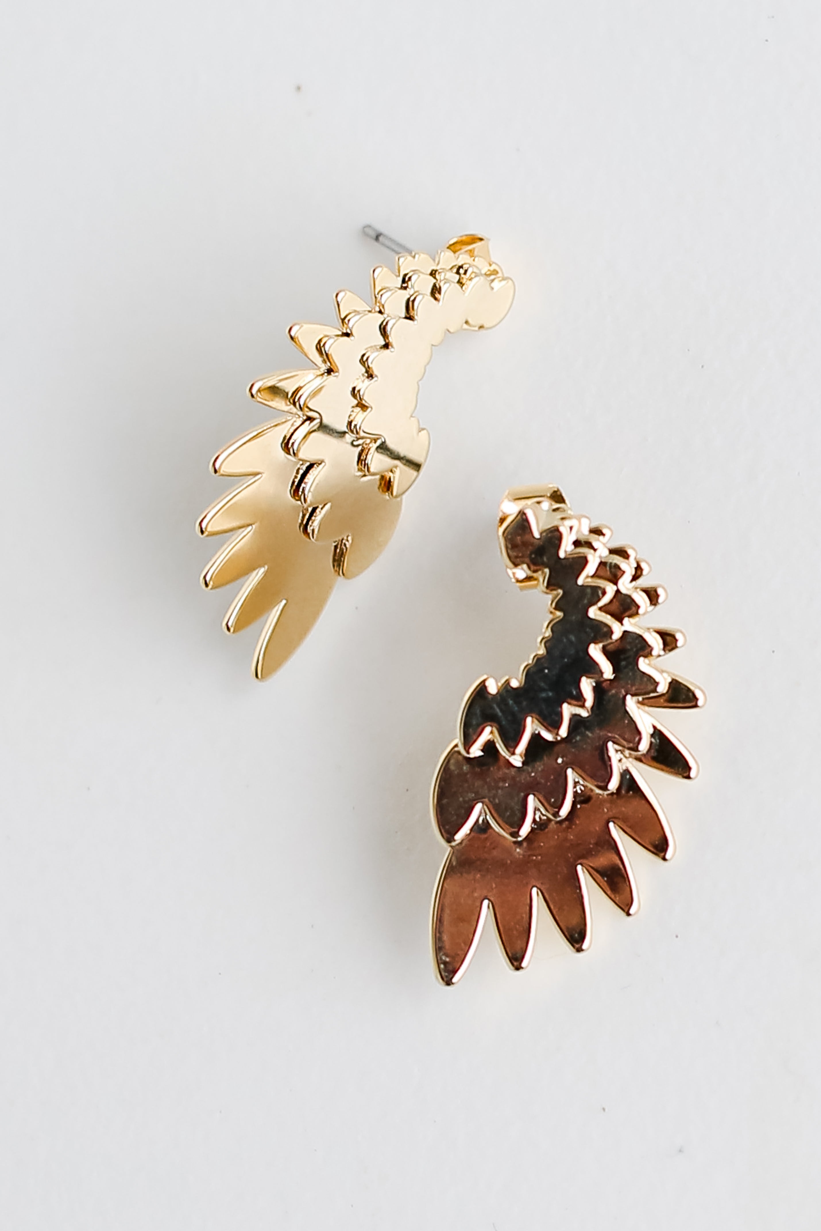 Gold Wing Earrings flat lay