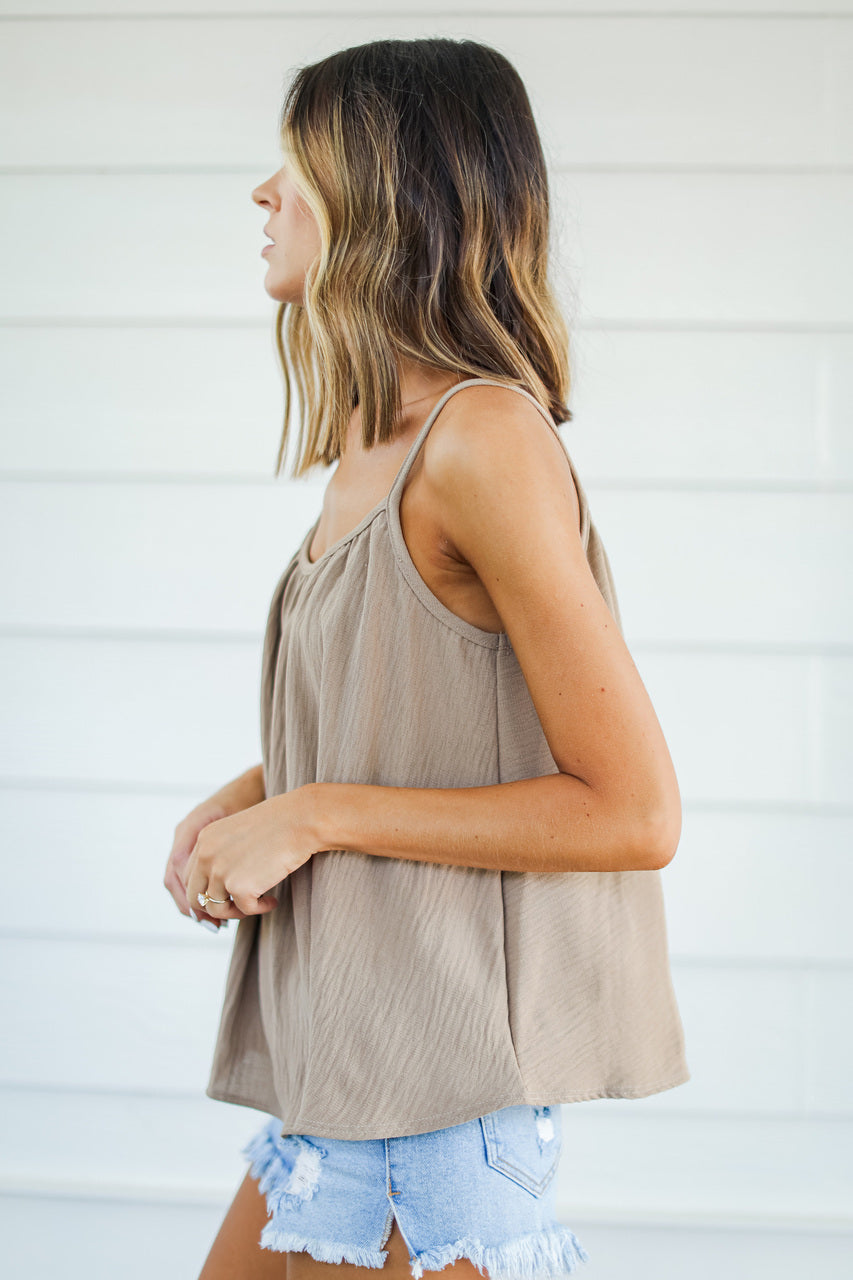 side view of model wearing taupe tank