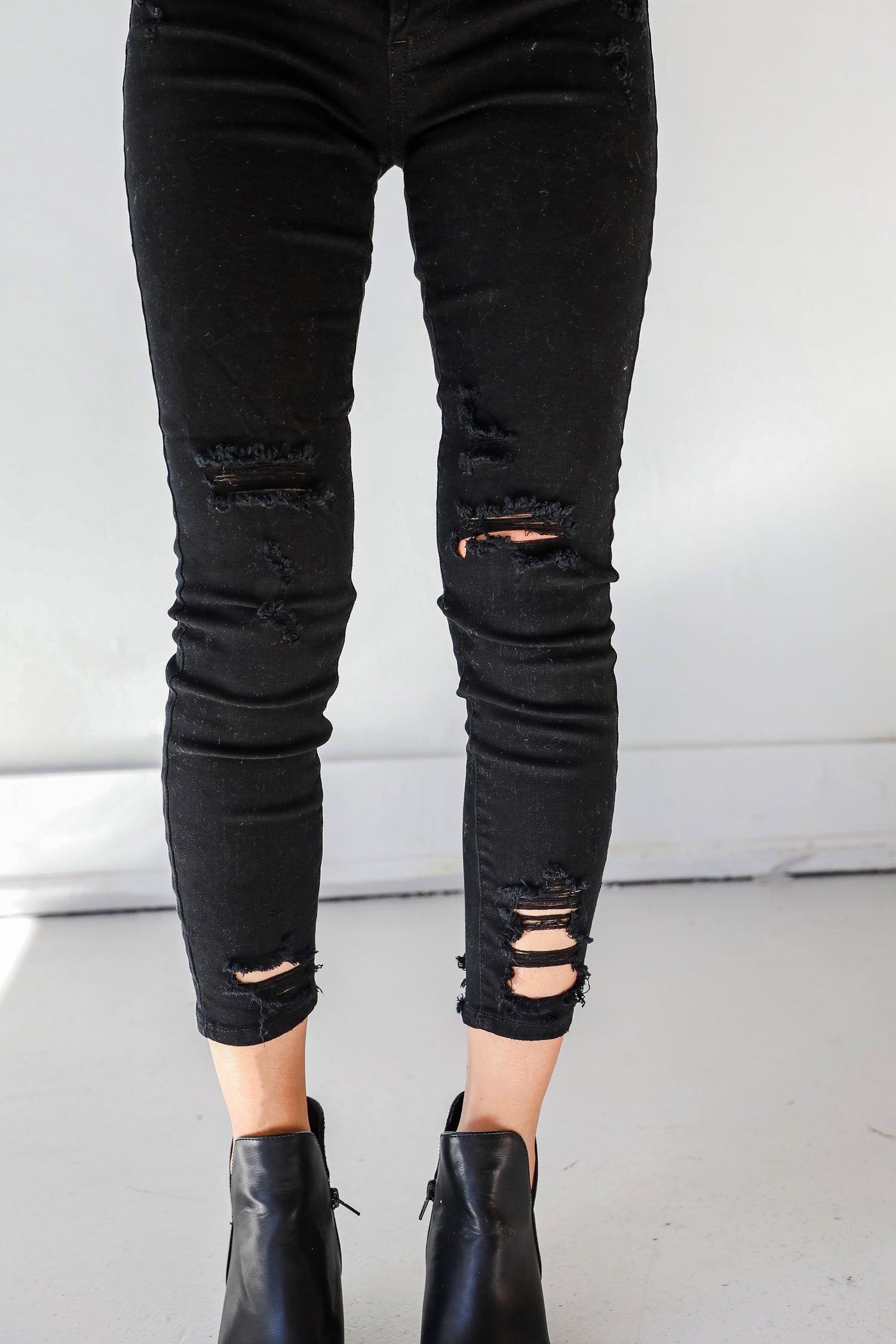 Distressed Black Skinny Jeans close up