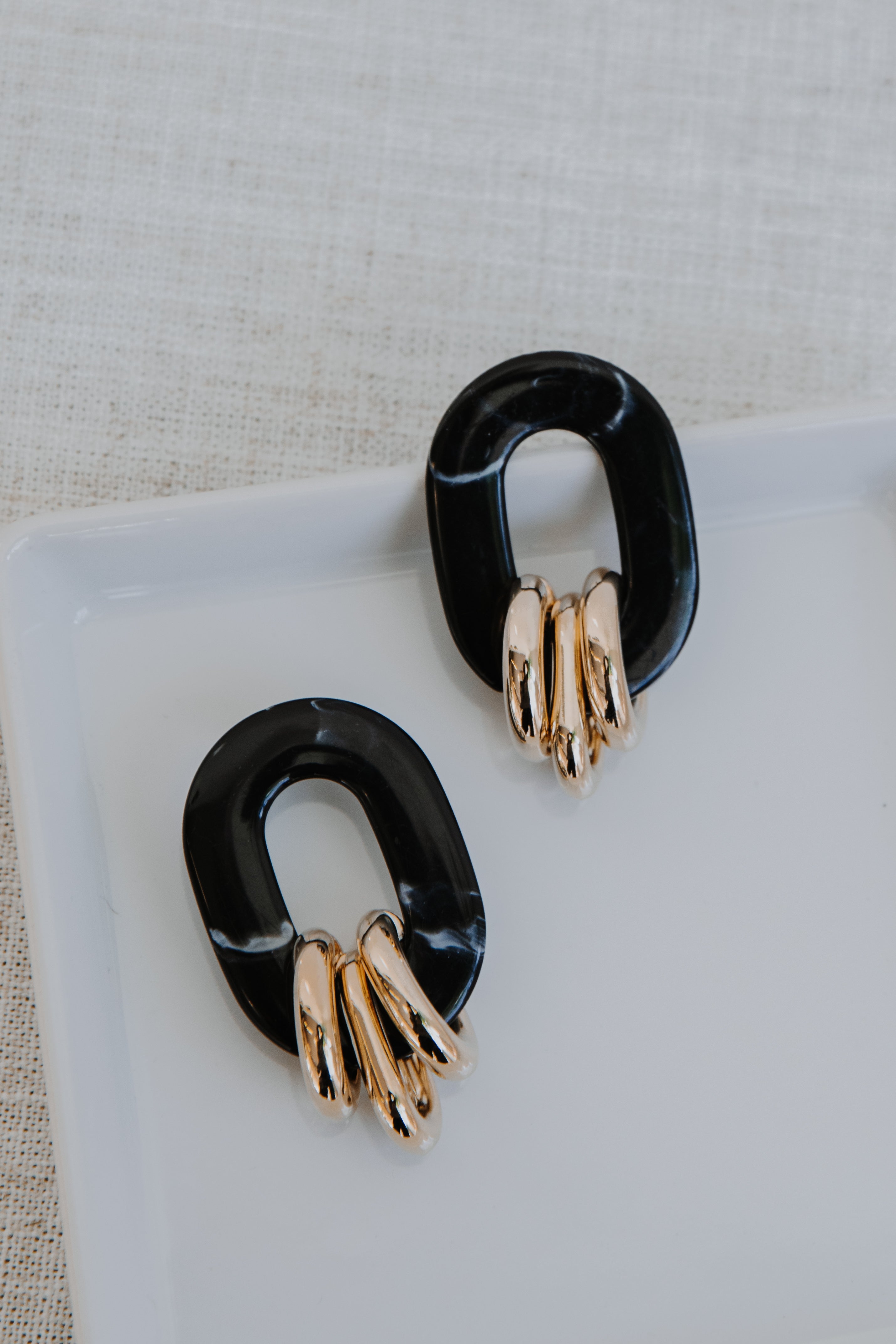 Acrylic Statement Earrings flat lay