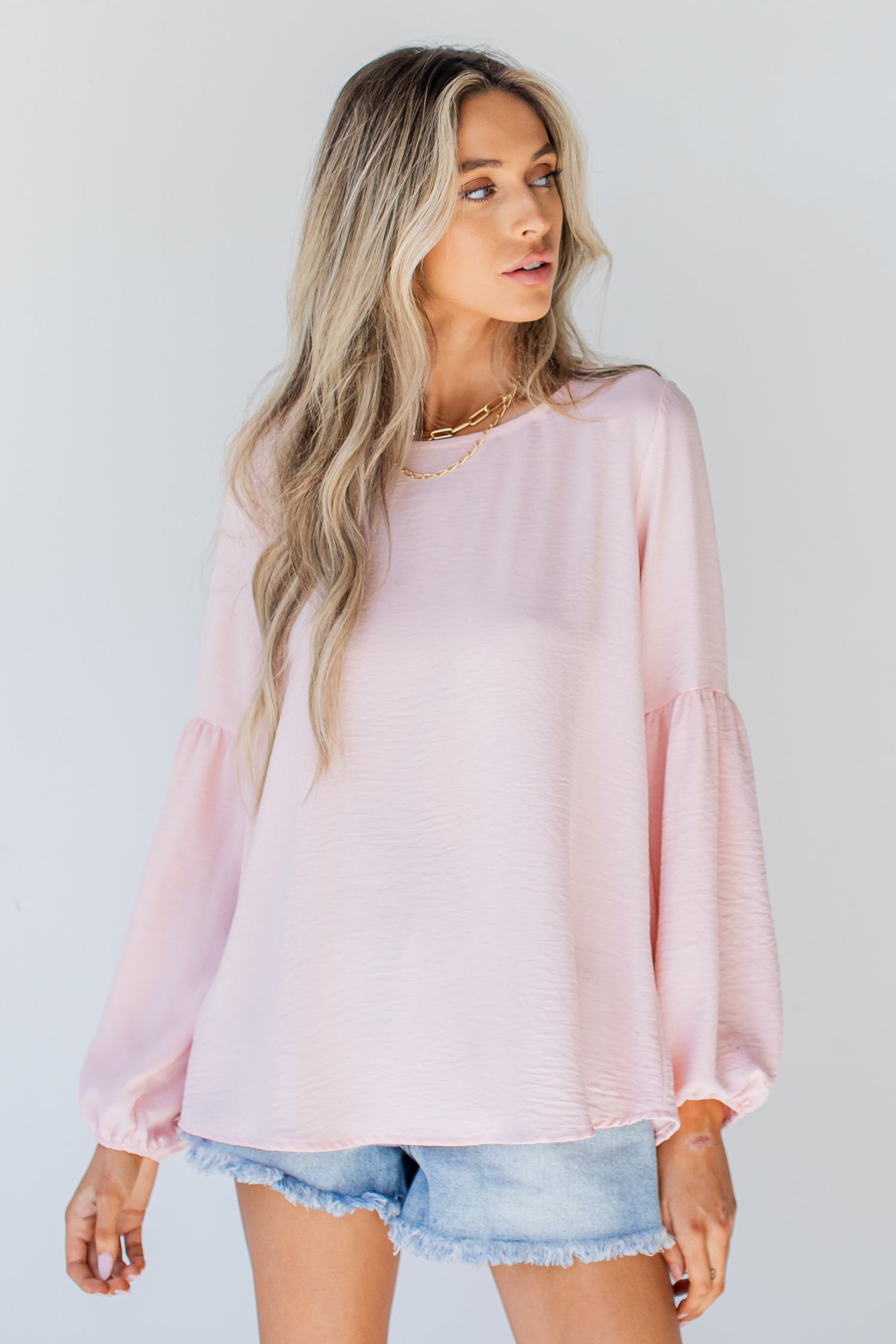 Blouse in blush on model