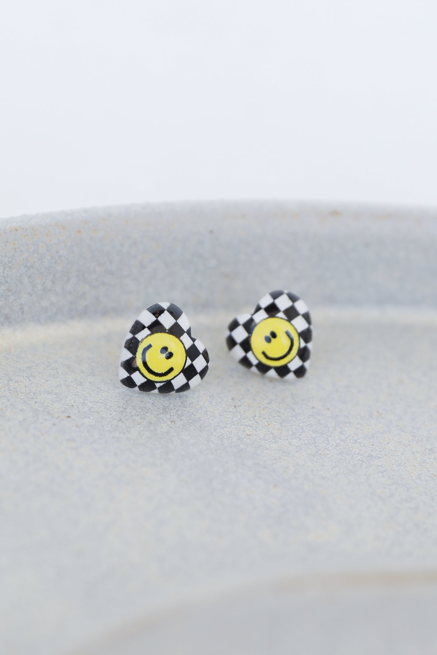 heart earrings in black flat lay