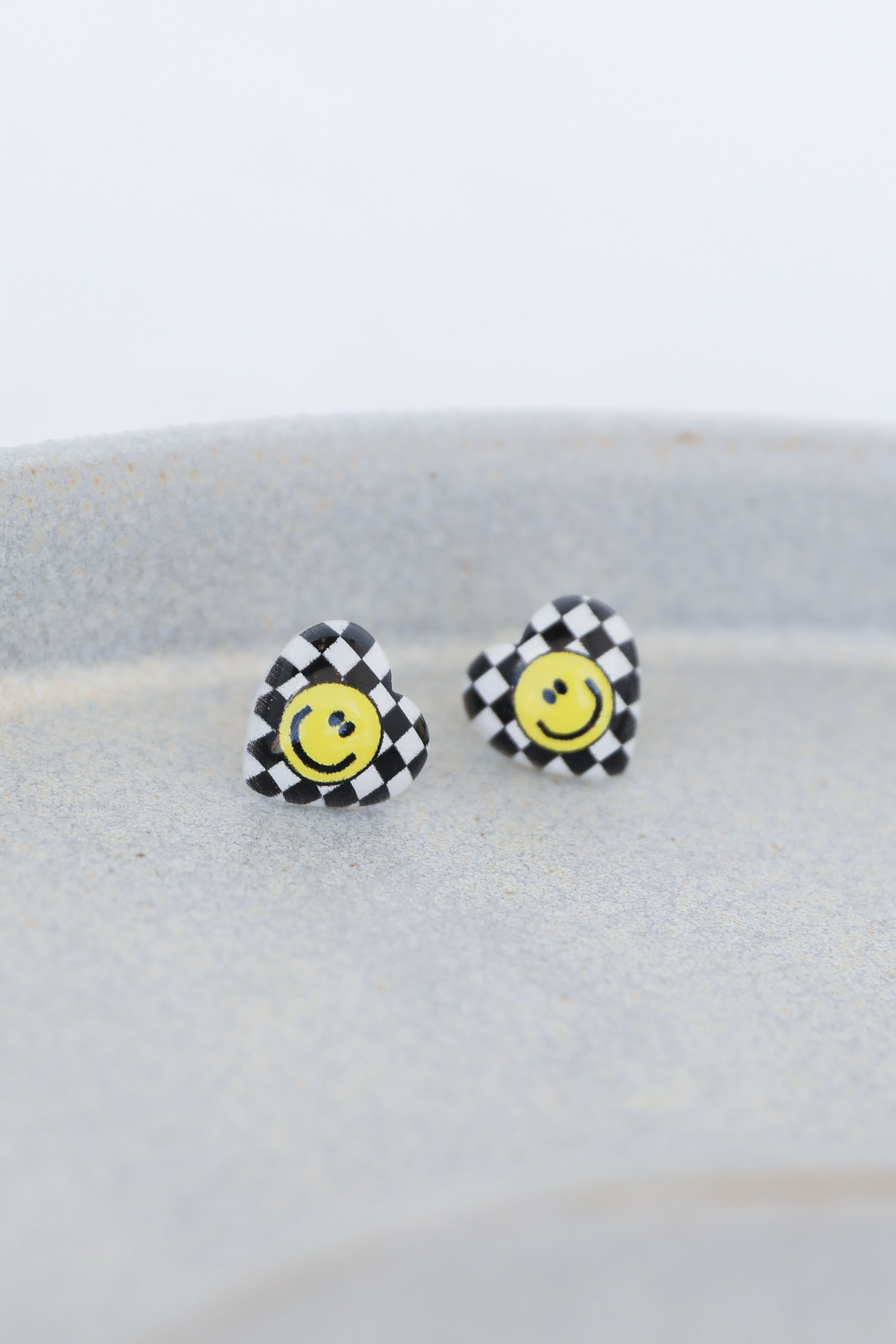 heart earrings in black flat lay
