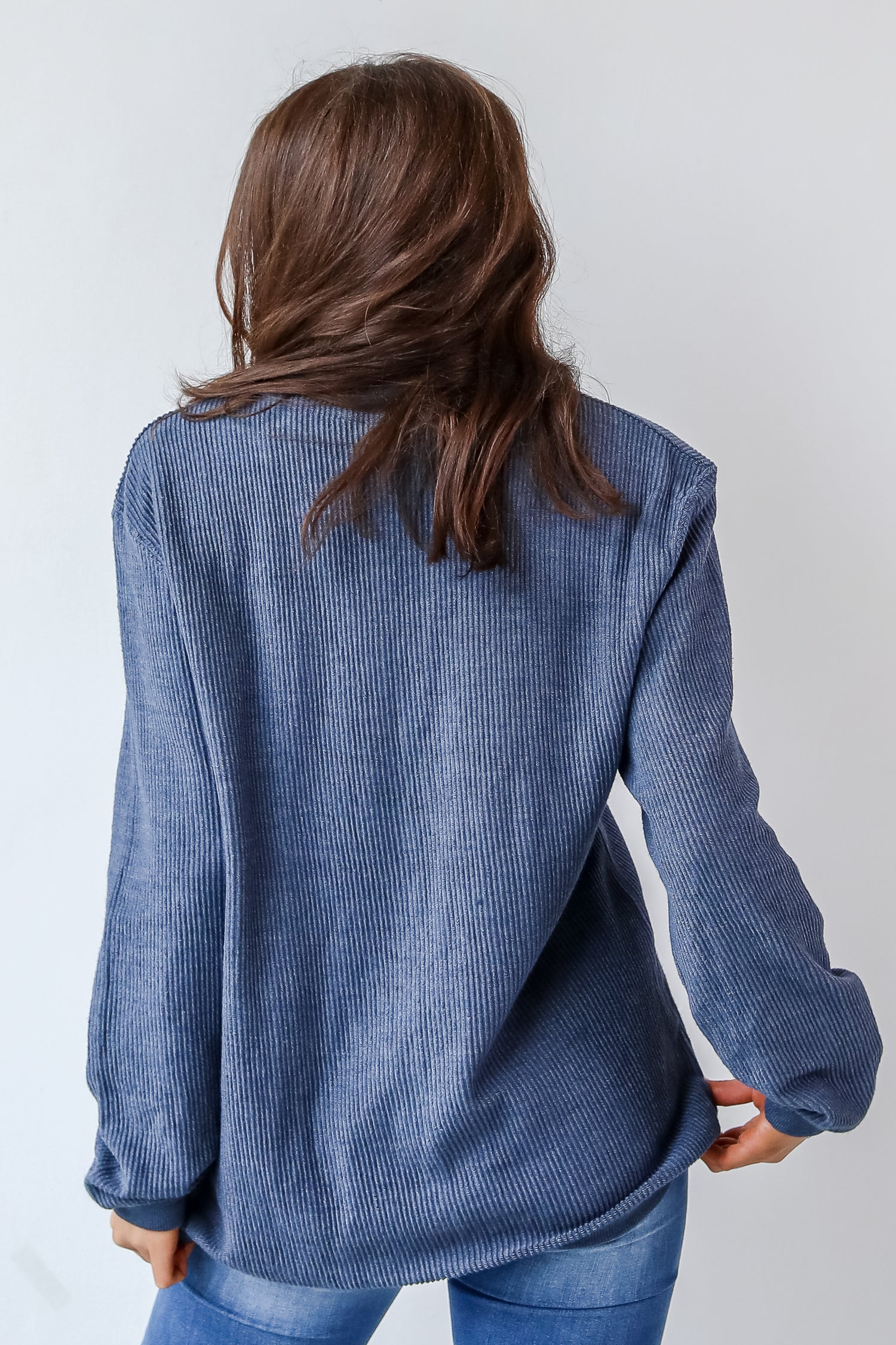 This comfy sweatshirt is designed with a soft and stretchy corded knit. It features a crew neckline, long sleeves, an oversized fit, and the words "Chop Chop" on the front.