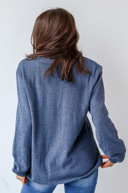 This comfy sweatshirt is designed with a soft and stretchy corded knit. It features a crew neckline, long sleeves, an oversized fit, and the words "Chop Chop" on the front.