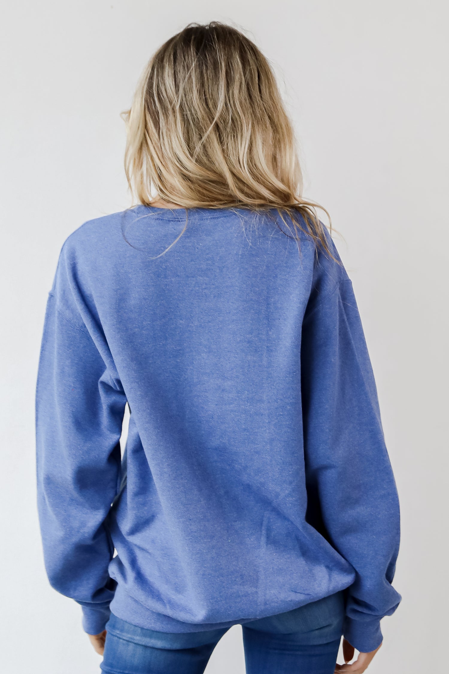 This comfy sweatshirt is designed with a soft and stretchy knit with a fleece interior. It features a crew neckline, long sleeves, a relaxed fit, and the words &quot;Chop Chop&quot; on the front. 