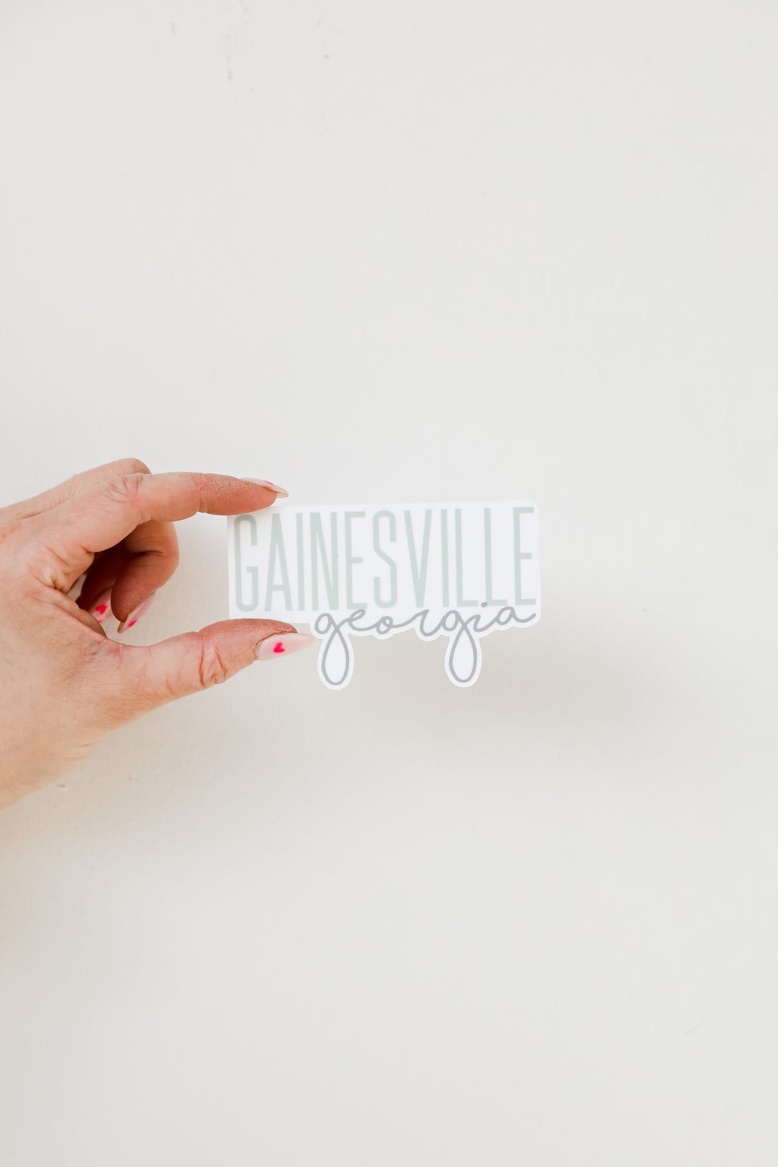 Gainesville Georgia Script Sticker flat lay