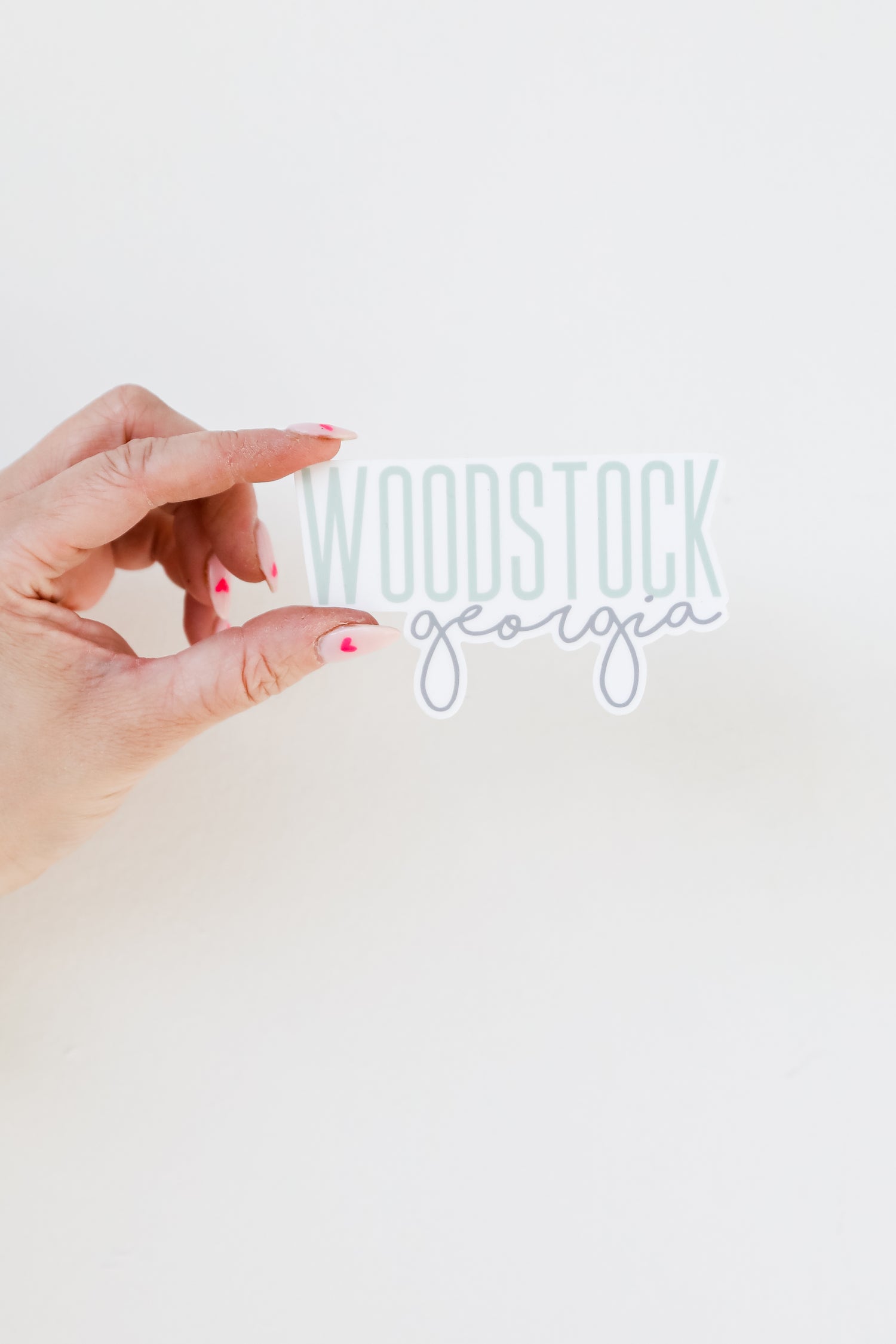 Woodstock Script Sticker flat lay