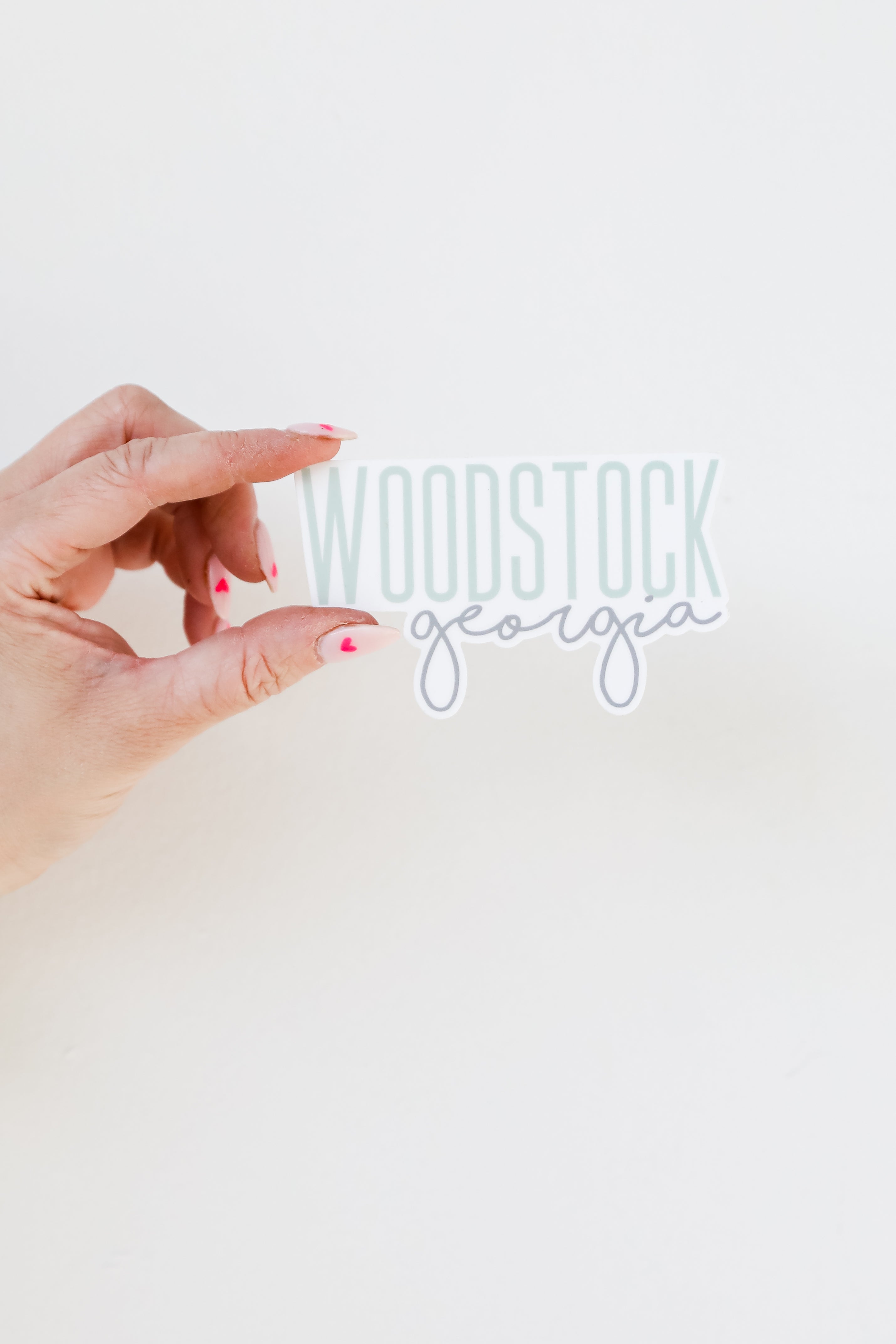 Woodstock Script Sticker flat lay