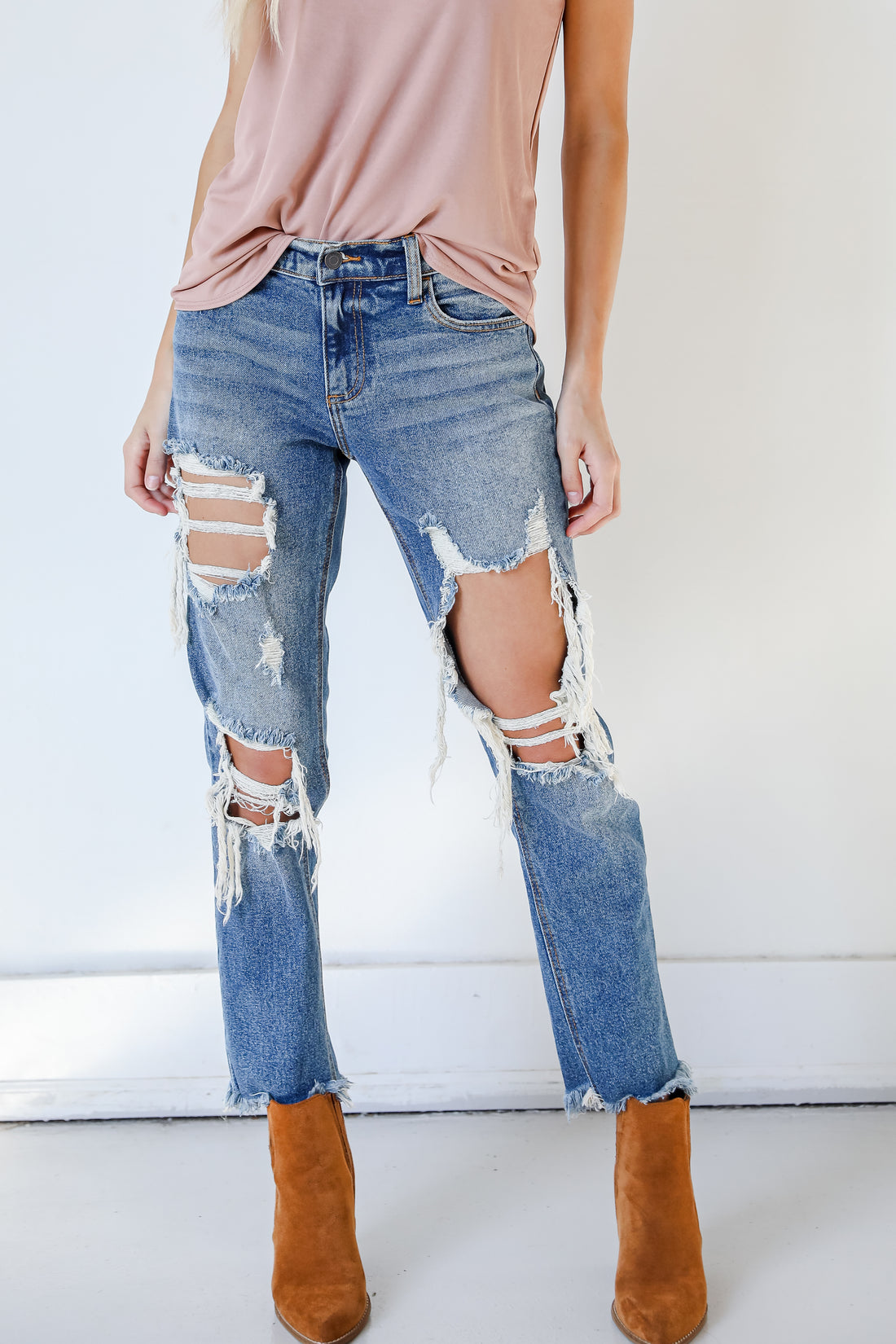 distressed denim jeans with booties