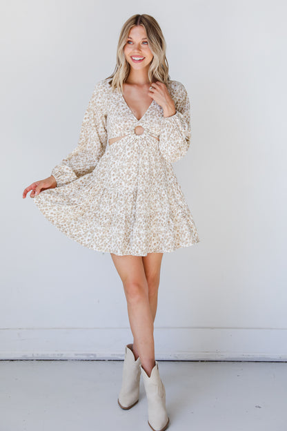 model wearing a Floral Cutout Mini Dress with western booties