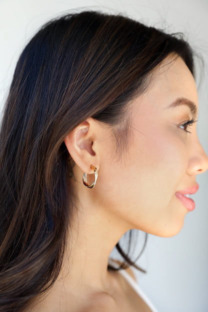 Gold Twisted Hoop Earrings on model