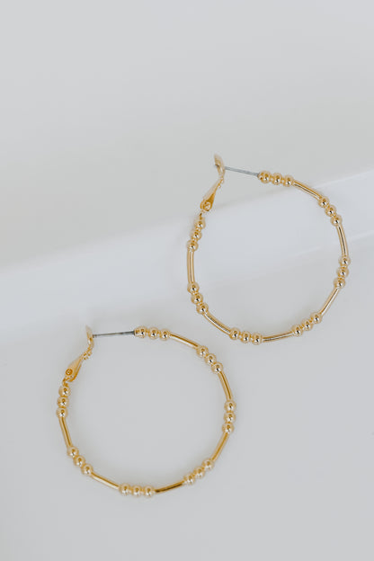 Gold Ball Hoop Earrings flat lay