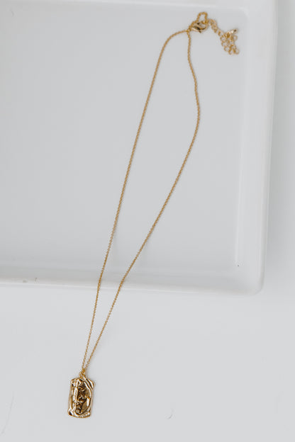 Gold Pendant Necklace flat lay