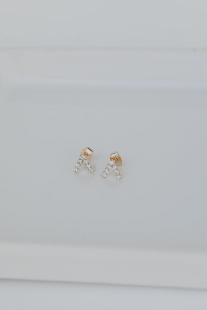 Gold Rhinestone V Stud Earrings flat lay