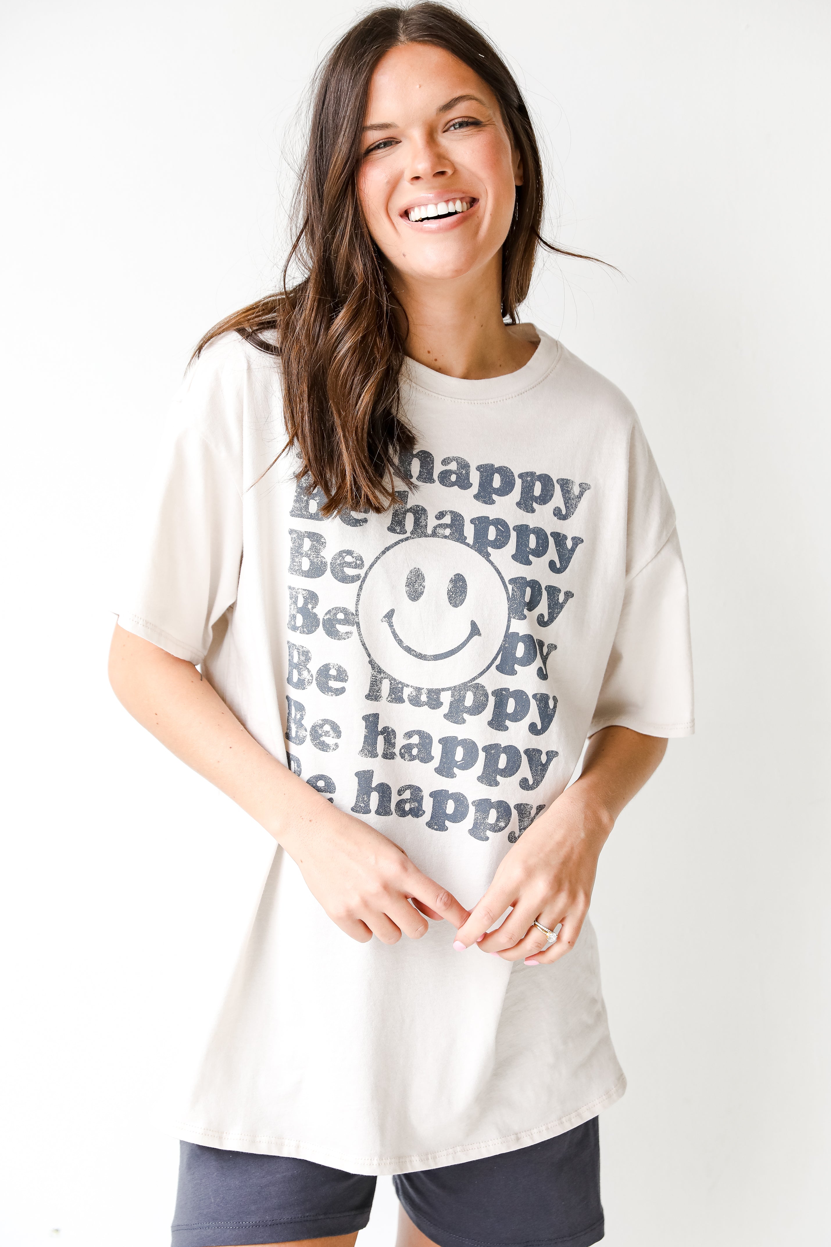Be Happy Smiley Face Graphic Tee front view