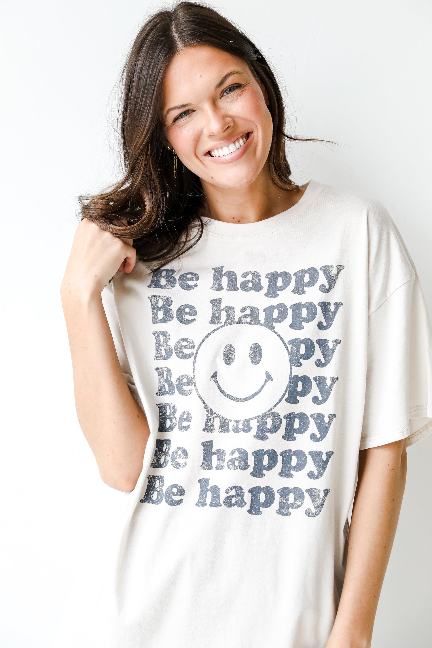 Be Happy Smiley Face Graphic Tee on model