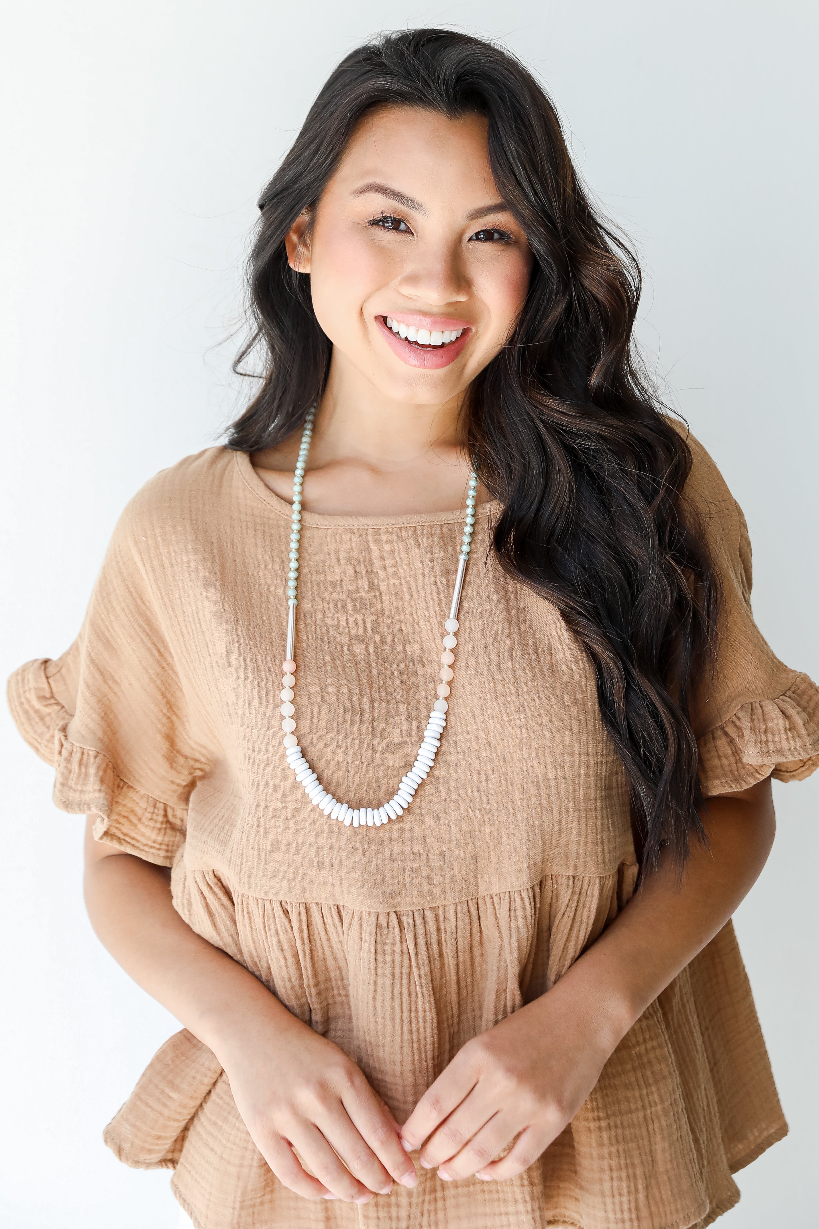 Linen Babydoll Top in camel on model