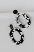 Acrylic Statement Earrings in black flat lay