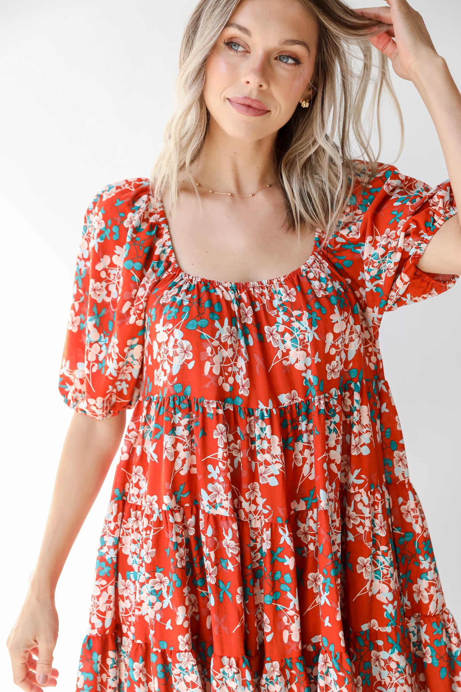 close up of a rust floral dress