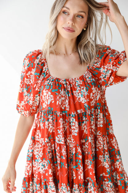 close up of a rust floral dress