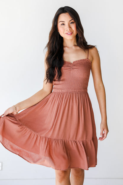 Smocked Mini Dress in clay on model