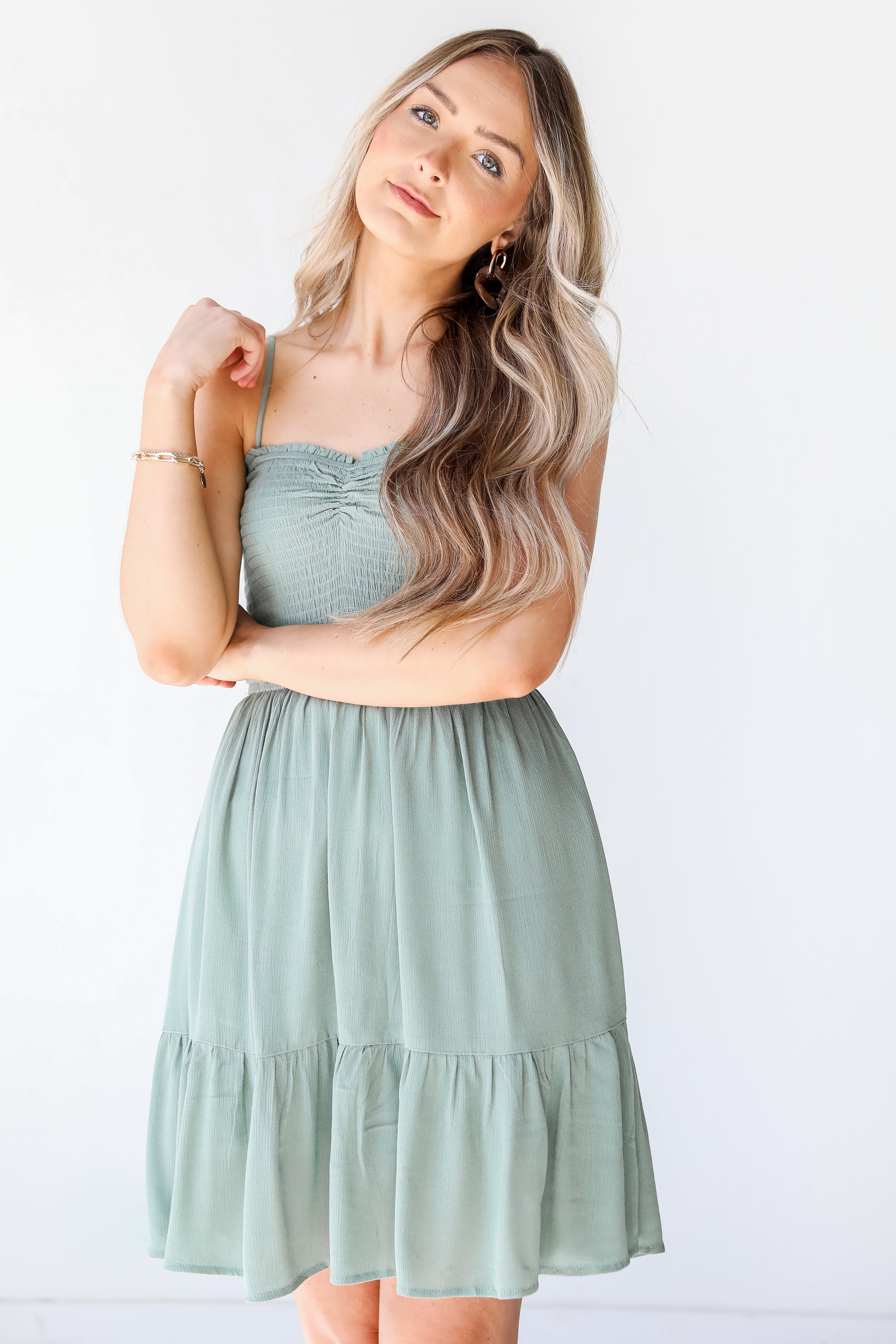 Smocked Mini Dress in sage on model