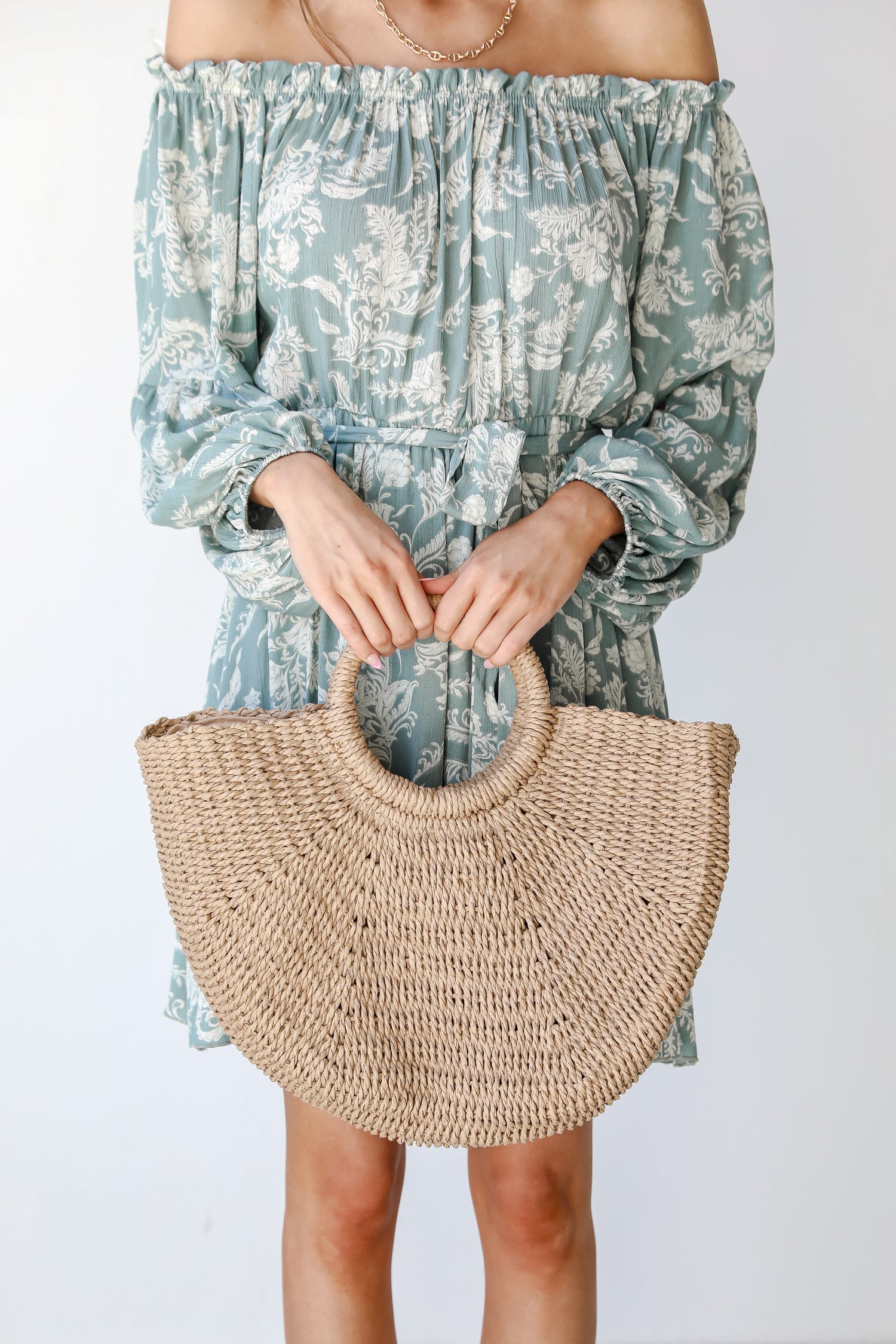 model holding a Straw Handbag