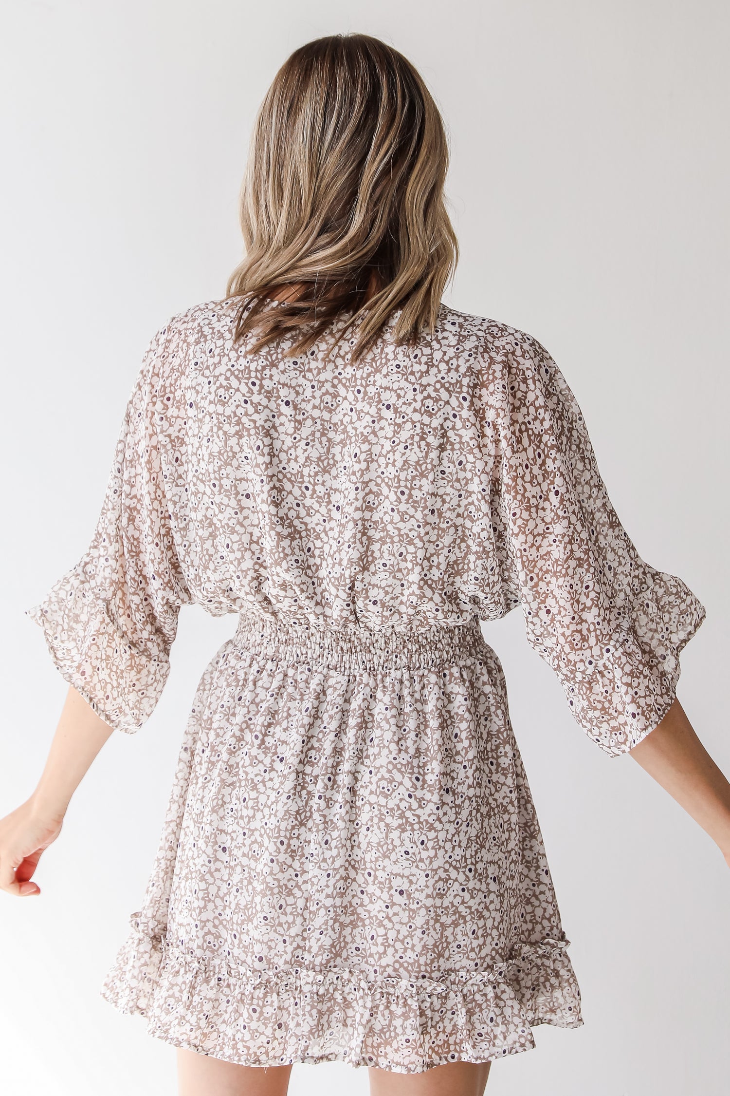 tan floral mini dress back view