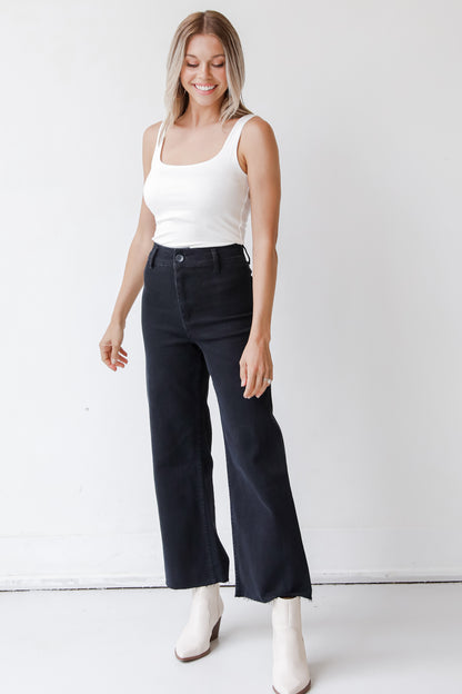 black straight leg jeans on model