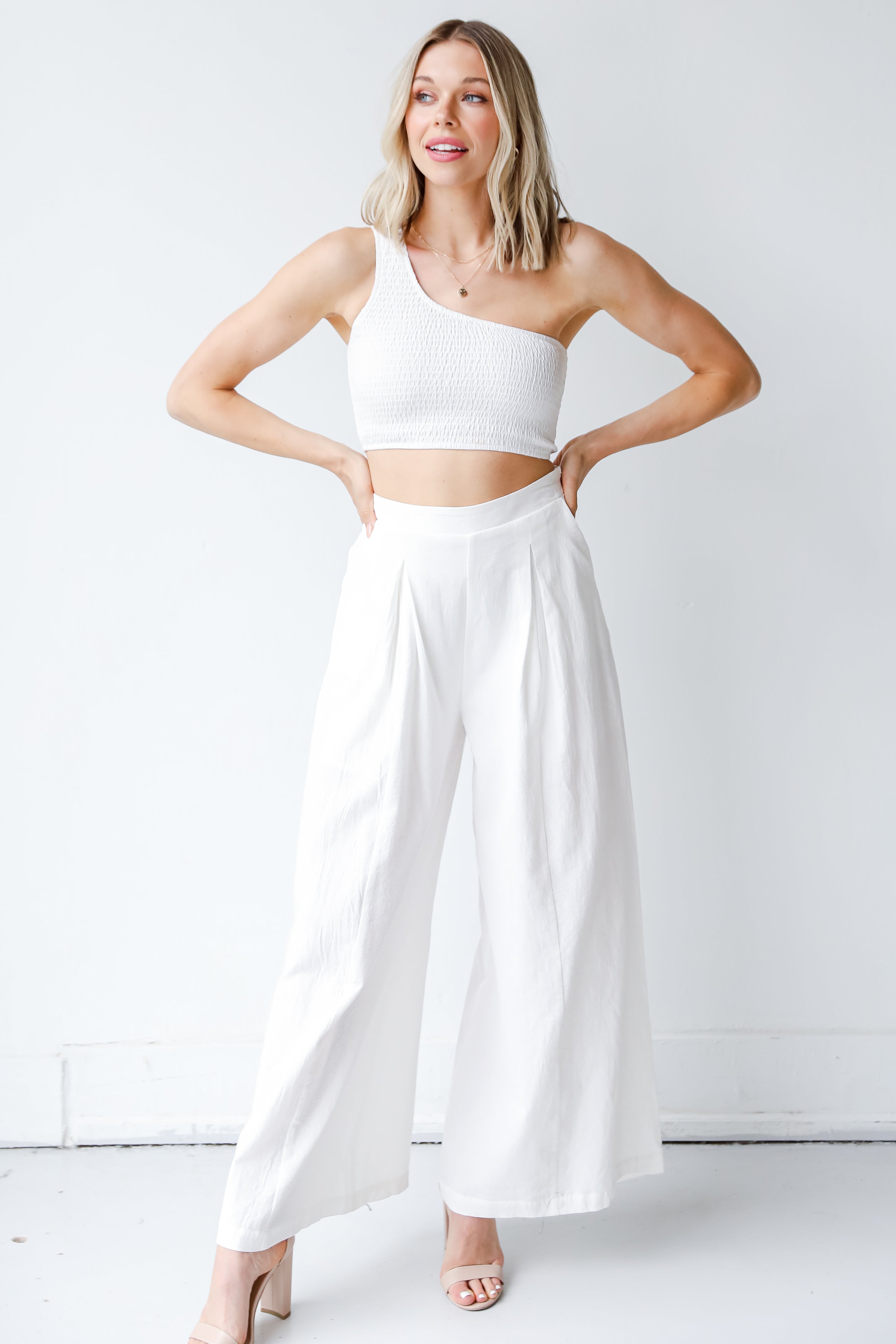 Smocked One-Shoulder Crop Top in white on model