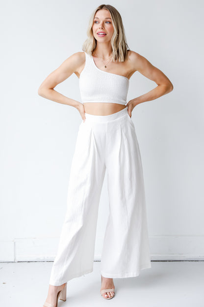 Smocked One-Shoulder Crop Top in white on model